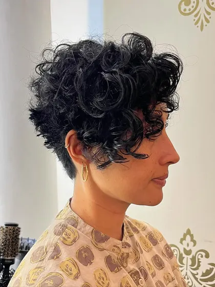 Bhamini wanted to go short, so I gave her this chic curly pixie bob. It's a bold look that's surprisingly easy to manage.