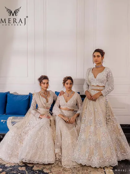 Three models showcase the versatility of ivory, each wearing a unique lehenga from the 'Ruvaah' collection, perfect for the bride and her bridesmaids.