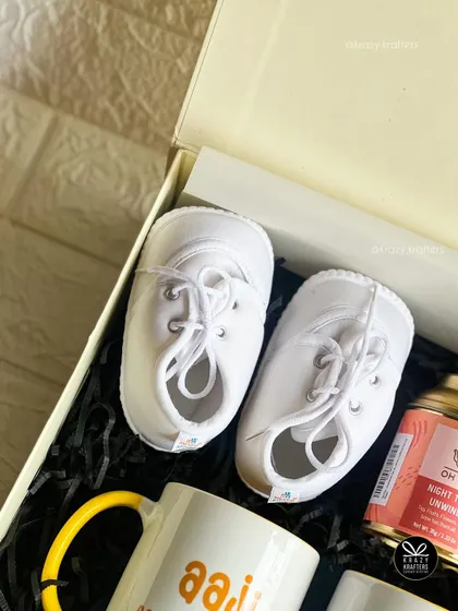 Sometimes, a tiny pair of shoes is all you need to say it all. We pair these adorable baby sneakers with custom mugs for the grandparents-to-be.
