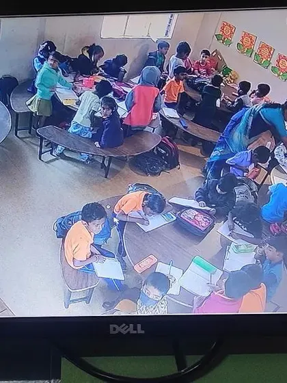 A view of a classroom with circular tables.