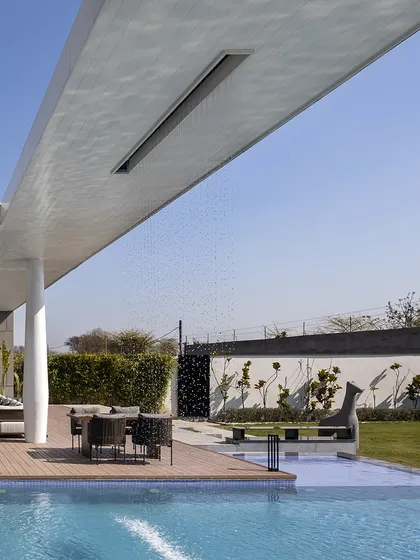 The backyard of the Ananda residence is where peace lives. A rain curtain cascades into the pool from an extended canopy, creating the soothing sound of water. The poolside deck is a perfect place to slow down and unwind.