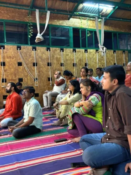 Participants listening intently during the "Neuroscience of Pranayama" session, highlighting the engaged and curious nature of our community.