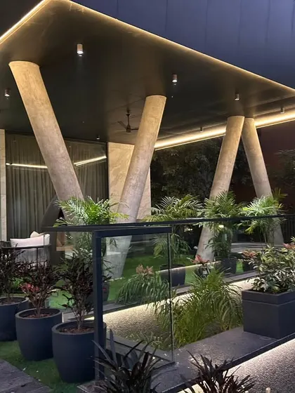 Another angle of the modern rooftop, showing the comfortable seating area under the large covered roof.