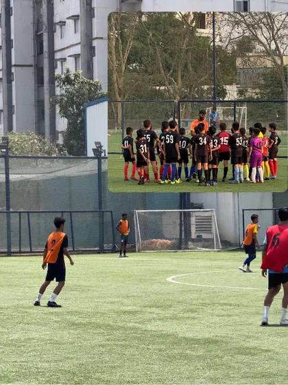 A coach huddles with the team, providing tactical instructions and encouragement. This direct mentorship is crucial for developing young players' understanding of the game.