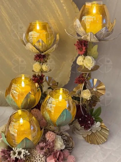 These golden lotus candle stands are one of my favorite pieces for Diwali decor. They add height and a warm, ambient glow to any festive arrangement, blending traditional motifs with a modern feel.