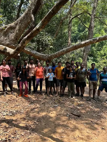 The full group by the riverside, ready for a day of trekking and swimming.