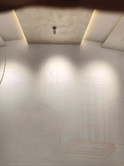 The initial phase of a large wall mural in Bandra, showing the foundational outlines sketched onto the wall. This stage is crucial for establishing the composition and perspective before any color is applied.