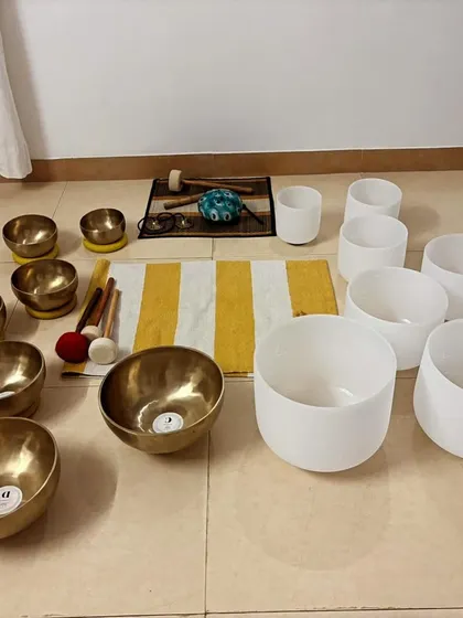 A combination of Tibetan and crystal singing bowls ready for a session. My course is unique in teaching you how to work with both types of bowls, expanding your range as a sound healer.