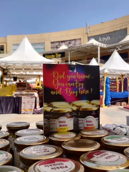 A close-up of my products with the market in the background. It's a vibrant setting for a vibrant brand.