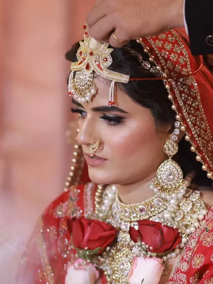 A candid moment during the wedding ceremony. My makeup is designed to withstand tears, sweat, and long hours, ensuring the bride looks perfect through every ritual.