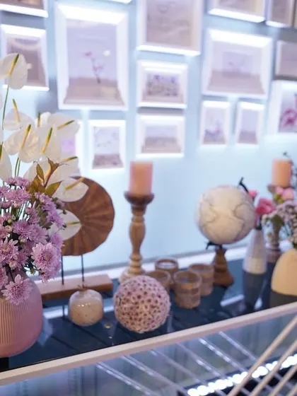 A curated collection of props and florals on a console table, demonstrating our ability to style spaces with a keen eye for detail and theme.
