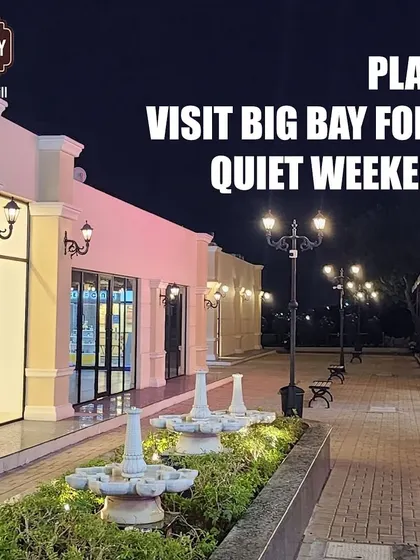 Part one of a meme, showing a serene, empty walkway with the text "Plan: Visit Big Bay for a quiet weekend."