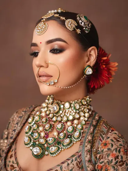 A detailed close-up of the eye makeup and the magnificent nath.