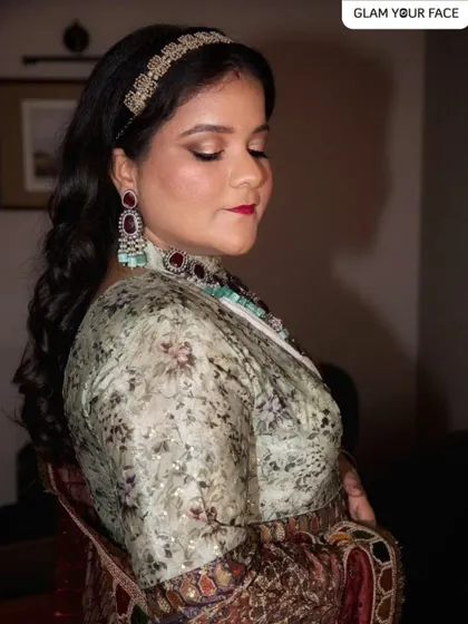 The only drama I like is on my client's eyes. This stunning look was for a first anniversary celebration, featuring dramatic eyes and a rich lip color that perfectly complements her intricate outfit.