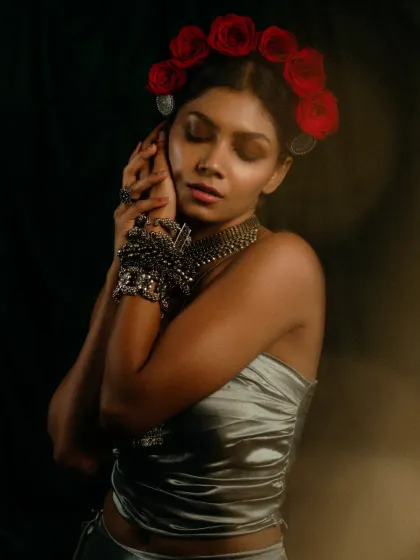 An expressive portrait from the 'INARA' series. The soft lighting and the model's serene expression contrast with the bold jewelry, creating a mood of quiet elegance and inner strength.