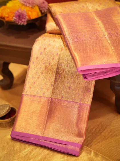 Another view of the gold and pink brocade Kanjivaram, a piece that symbolizes prosperity and heritage.