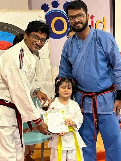 Progression is a core part of the karate journey. A proud moment as one of our youngest students receives her certificate and new belt during a grading examination, marking a successful step forward in her martial arts development.