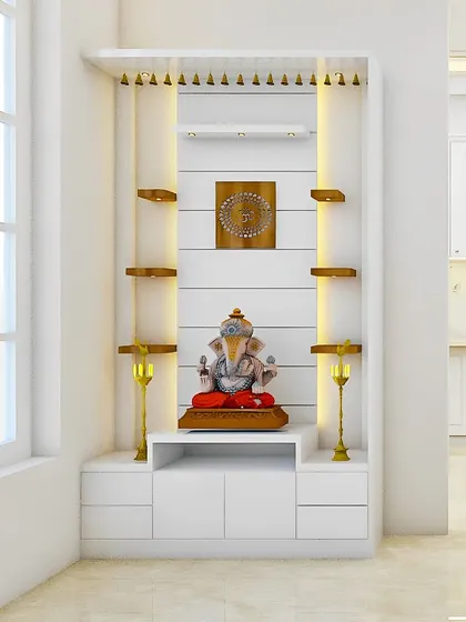 A bright and beautiful pooja unit in all white, with wooden shelves and tiny decorative bells hanging from the top. It's perfect for a space next to a window.
