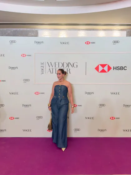 Posing on the purple carpet. My personal style is a reflection of the bold and confident energy I bring to my styling work.