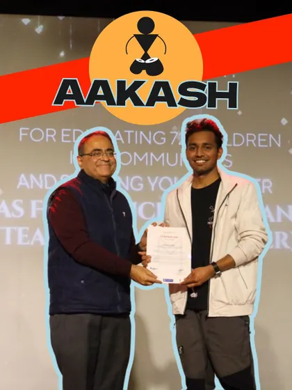 Graduating fellow Aakash receives his certificate. He not only educated 78 children but is also moving on to become a full-time musician and teacher.