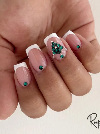 This view highlights the clean, sharp lines of the square French tips, which provide a perfect canvas for the intricate crystal work.
