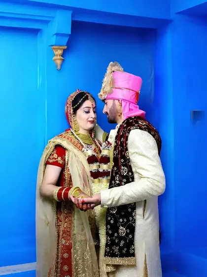 The vibrant blue background makes this couple's portrait pop. I love using bold colors to create memorable and striking wedding images.