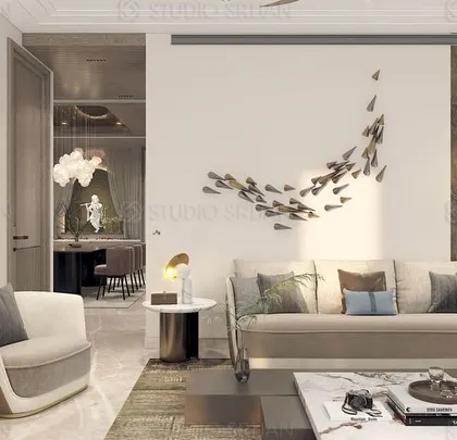 A wider view of the DLF living room, showing the open-plan connection to the dining area and the use of a sculptural bust to add a classic touch to the modern space.
