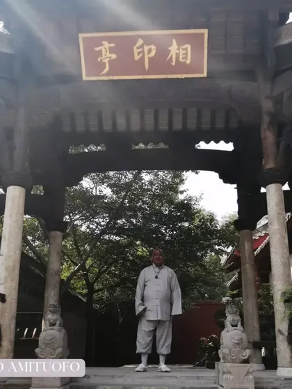 Standing at the entrance of a temple in the Songshan mountains. These rare photographs document the sacred architecture and serene atmosphere of the home of Zen Buddhism.