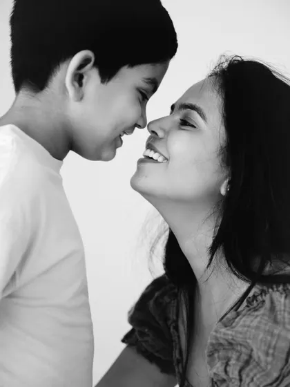 A beautiful black and white close-up. This intimate nose-to-nose portrait captures the deep, unspoken connection between a mother and her child.