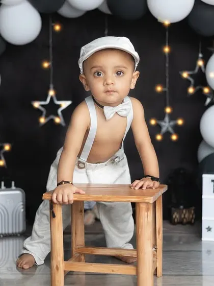 Tanush turns one! Using a lightbox is a great way to personalize the birthday setup.