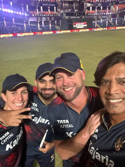 A post-victory selfie with the coaching staff. The camaraderie and teamwork within the support staff is just as important as it is on the field.