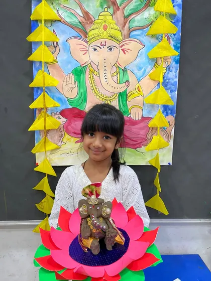 This student created a beautifully decorated Ganesha, complete with a paper lotus base, showcasing her crafting skills.