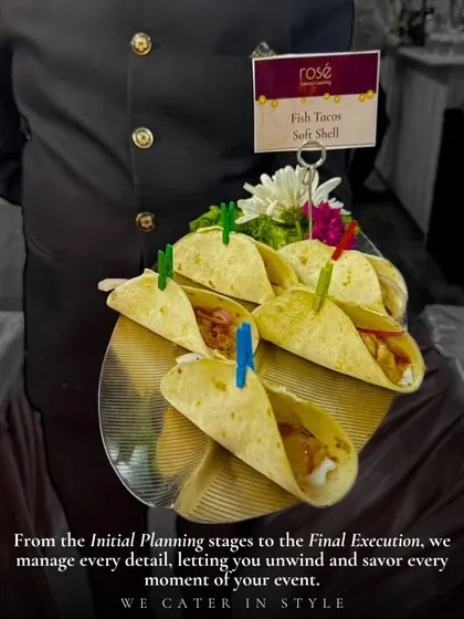 A server presents a tray of soft-shell fish tacos. This is an example of how we incorporate global street food trends into our menus, offering guests a unique and modern culinary experience.