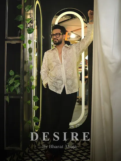 A full-length shot of the sheer floral shirt, showcasing its unique transparency and the confident statement it makes.