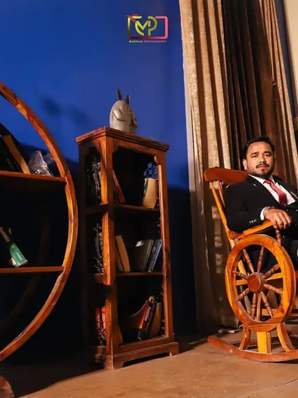 A solo portrait of the groom during a pre-wedding shoot. This shot gives him a moment to shine, capturing his personality in a stylish, relaxed pose.