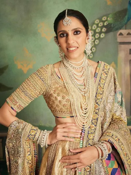 A close-up of the 'Hastakshar' look, highlighting the intricate animal motifs on the dupatta and the stunning layered pearl necklace. Every detail was carefully considered to tie into the Jamnagar theme.