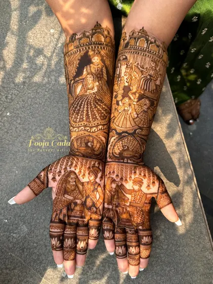 A very heavy and dense bridal design filled with intricate figures and patterns, perfect for the bride who wants a truly grand statement.