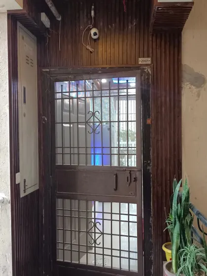 The entrance of a home featuring PVC panel work on the walls for a quick and budget-friendly makeover.