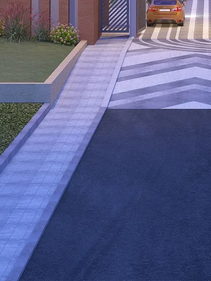 This image focuses on hardscape design, showing a creative use of patterned pavers for a driveway that adds graphic interest to a functional space.