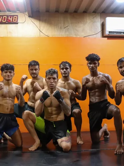 The fight team, focused and ready. The clock in the background is a reminder that every second counts, in training and in the cage. We are prepared.