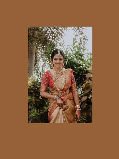 A beautiful portrait of the bride, framed in a warm brown border.