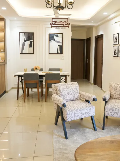 This view shows the open-plan layout connecting the living and dining areas, creating a spacious and sociable environment.