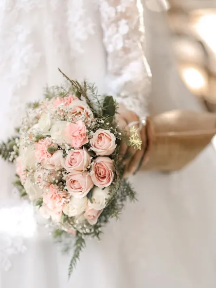 A close-up shot of the bride's beautiful pink and white rose bouquet.