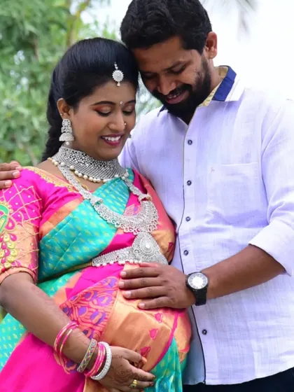 A candid moment from the maternity shoot. The couple looks so in love, and the sparkling CZ jewellery adds to the magic of the moment.