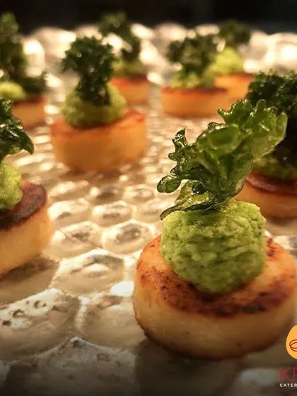 An Italian classic reimagined as a canapé. These pan-seared gnocchi are topped with a broccoli pesto and crispy kale, showcasing our creative approach to gourmet catering.