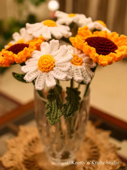 Sunny Blooms. A cheerful bouquet of crochet daisies and sunflowers, guaranteed to brighten any day.