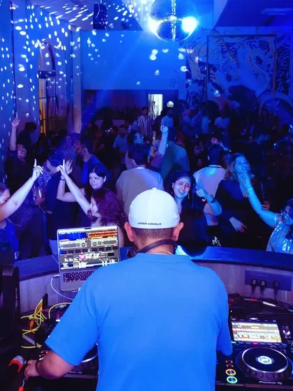 A view from my perspective, looking out at a packed and energetic dance floor.