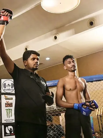 The referee raises our fighter's hand after a successful comeback fight at Xtrim Fight Night in Mysore. This is what perseverance looks like.