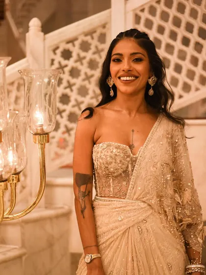 A joyful, candid shot of Anasuya Sengupta at an event. Her smile is infectious, and it’s a moment of pure happiness.