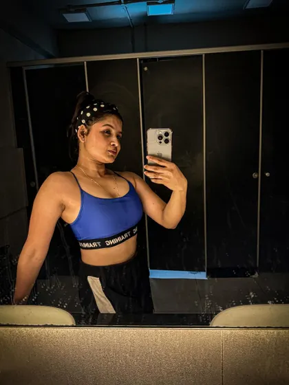 A confident mirror selfie after a great session. My philosophy is about doing what makes you feel strong and powerful, and for me, that's hitting the gym and pushing my limits.